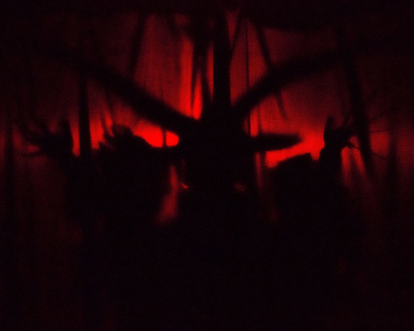 silhouette of baphomet with red light